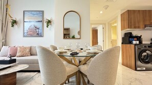 Apartment (228) | Living area | 58-inch flat-screen TV with cable channels - Masdar Oasis 1 Modern Apartmenst By Rhh (Abu Dhabi)