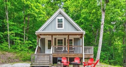Quaint cottage with 3 queen beds and screened porch.