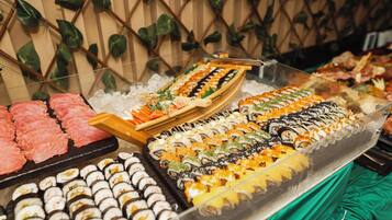 A variety of sushi and sashimi on display.