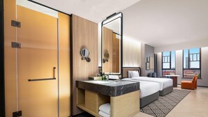 A hotel room with a bed, a vanity with a mirror, a bathroom with a toilet, and a view of the city through large windows. - Days Hotel By Wyndham Changsha Xingsha (Changsha)