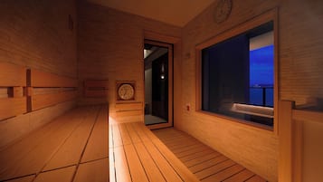 A wooden interior with a bench, a clock, and a window with a view.