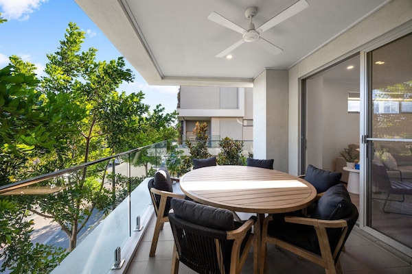 Step outside for morning coffee or casual meals, with a covered balcony extending the living space outdoors.