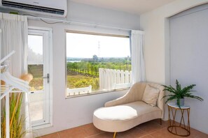 Comfort vierpersoonskamer, balkon, uitzicht op tuin | Interieur