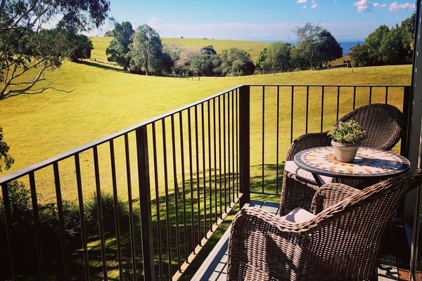View from the upstairs deck to the farm and coastline.