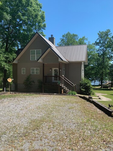 Lake side apartment with shared 100’ pier and pavilion with rock BBQ pit.