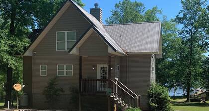 Lake side apartment with shared 100’ pier and pavilion with rock BBQ pit.