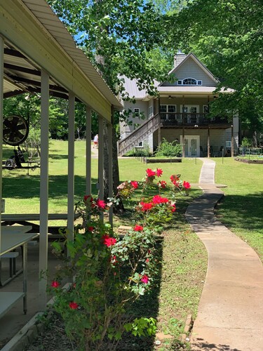 Lake side apartment with shared 100’ pier and pavilion with rock BBQ pit.