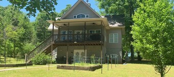 Lake side apartment with private 100’ pier and pavilion with rock BBQ pit.