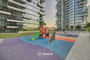 Children’s area - Manzil - Luxury 1BR with Rooftop Pool  (Dubai)
