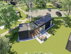 A modern house with a large glass patio, a swimming pool, and a well-maintained lawn.