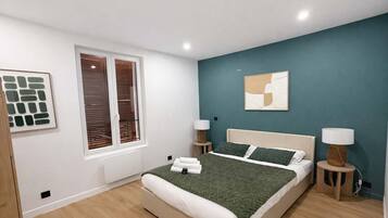 1 slaapkamer, een strijkplank/strijkijzer, wifi, beddengoed