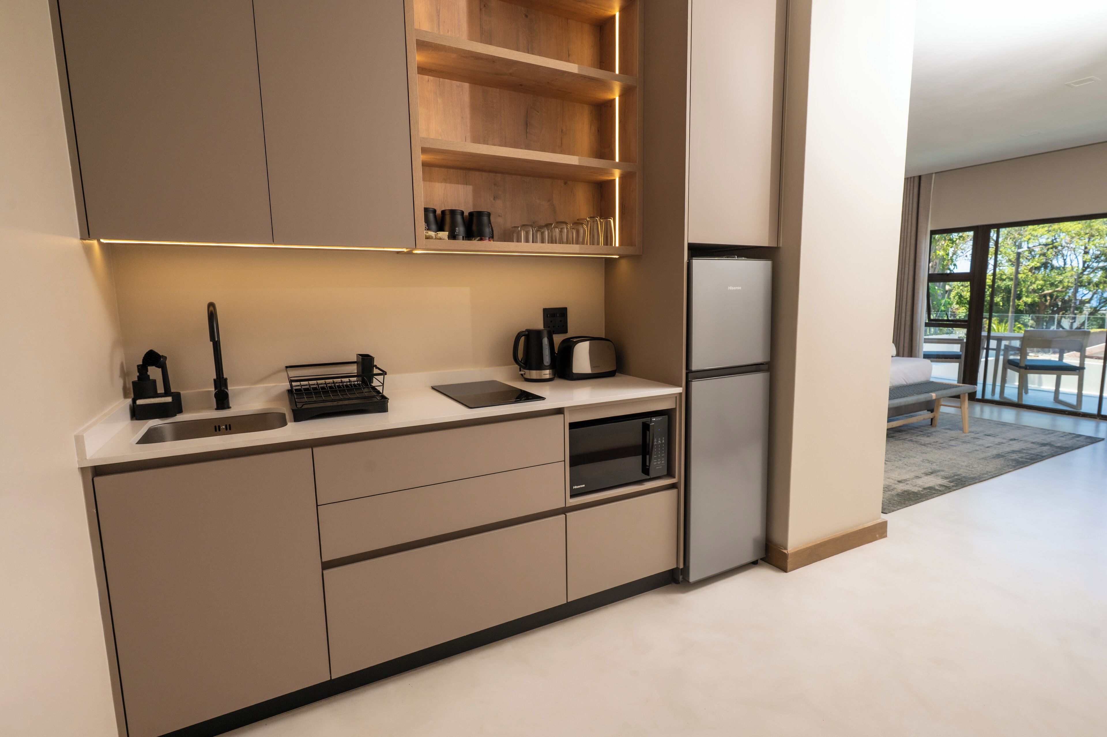 Full-sized fridge, microwave, stovetop, cookware/dishes/utensils