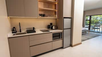 Full-sized fridge, microwave, stovetop, cookware/dishes/utensils