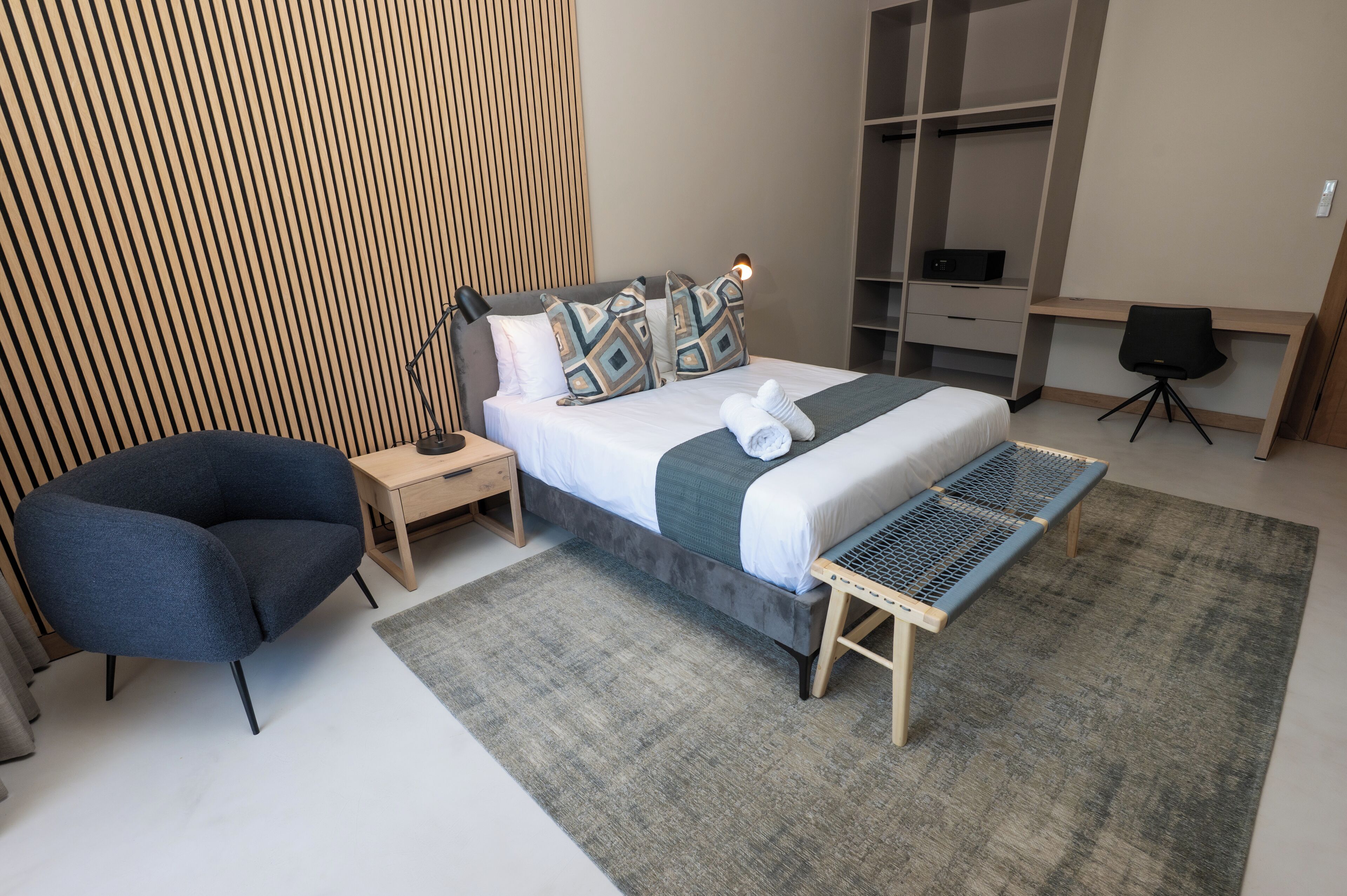 Luxury Studio Suite, Pool View | In-room safe, desk, laptop workspace, blackout drapes