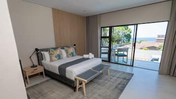 Luxury Studio Suite, Balcony, Sea View | In-room safe, desk, laptop workspace, blackout drapes