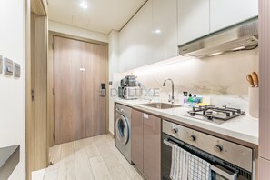 Fridge, microwave, stovetop, coffee/tea maker