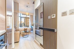 In-room safe, iron/ironing board, free WiFi, bed sheets - Contemporary Studio Apartment with Balcony & Community Views - Azizi Riviera 48, Al Merkadhby Deluxe Holiday Homes (Dubai)