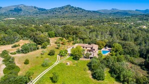 A villa with a swimming pool, surrounded by lush greenery and hills. - Stunning home in Arta with private swimming pool, can be inside or outside (Arta)