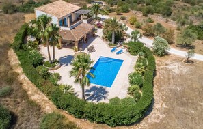 A large house with a swimming pool surrounded by lush greenery. - Awesome home in Santanyi (Santanyi)