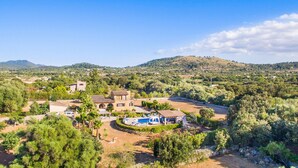 A villa with multiple buildings, a swimming pool, and surrounding greenery. - Lovely home in Arta with private swimming pool, can be inside or outside (Arta)