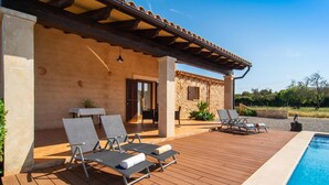 A poolside area with lounge chairs and a covered patio. - Cozy home in Arta with private swimming pool, can be inside or outside (Arta)