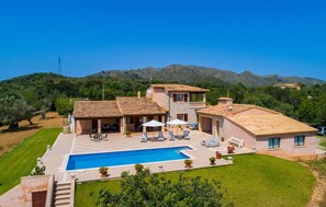 A villa with a swimming pool, outdoor seating, and a view of the surrounding hills. - Amazing home in Arta with private swimming pool, can be inside or outside (Arta)