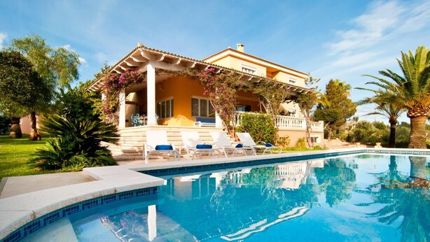 A two-story house with a pool, surrounded by palm trees and a garden. - Awesome home in Colonia de Sant Jordi (Colonia de Sant Jordi)
