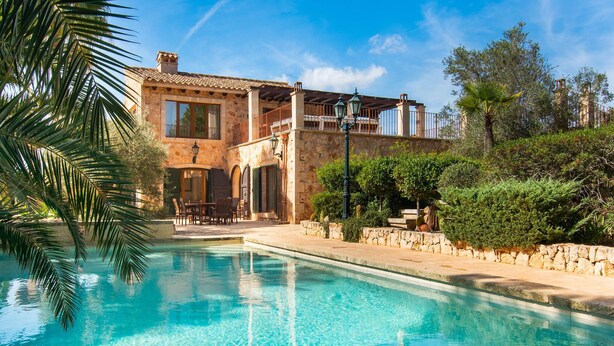 A two-story stone building with a swimming pool in front. - Nice home in Porto Colom with private swimming pool, can be inside or outside (Porto Colom)