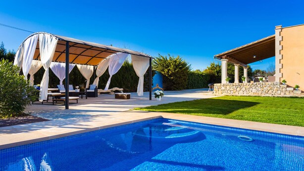 A swimming pool with a covered patio area and outdoor seating. - Cozy home in Manacor with private swimming pool, can be inside or outside (Manacor)