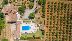 An aerial view of a residential property with a swimming pool, patio area, and a large garden. - Stunning home in Felanitx with private swimming pool, can be inside or outside (Felanitx)