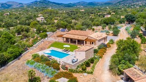 A villa with a swimming pool, outdoor seating, and a garden. - Lovely home in Arta with private swimming pool, can be inside or outside (Arta)