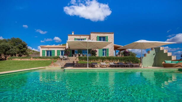 A two-story stone house with a swimming pool in front. - Nice home in Alqueria Blanca (Alqueria Blanca)