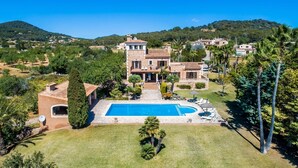 A large house with a swimming pool, surrounded by lush greenery and hills in the background. - Lovely home in SHorta with private swimming pool, can be inside or outside (SHorta)