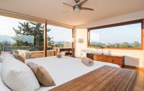 A bedroom with a large bed, a desk, and a view of the outdoors. - Nice home in Buger with private swimming pool, can be inside or outside (Buger)
