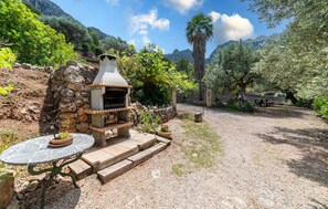 Outdoor dining - 3 bedroom gorgeous home in Cala Tuent (Cala Tuent)
