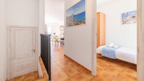 A hotel room with a bed, a painting, and a view of the sea. - 2 bedroom gorgeous apartment in Arta (Arta)