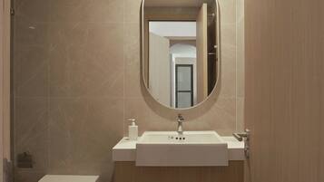 Hydromassage showerhead, designer toiletries, hair dryer, bathrobes