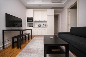Condo supérieur | Salle de séjour | Téléviseur au plasma de 100 cm avec télévision numérique