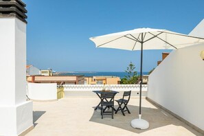 Apartment, Balcony, Partial Sea View | Outdoor dining - AffittaSardegna - Casa Sunrise  (Porto Torres)