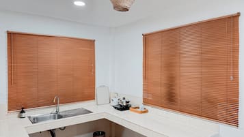 Villa, Garden View | Private kitchen | Full-size fridge, microwave, stovetop, cookware/dishes/utensils