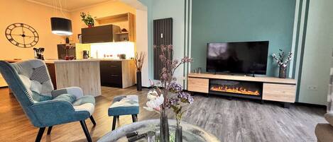 Smart TV, fireplace, DVD player, books