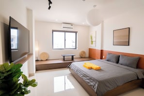 Deluxe Double Room, City View | Free minibar items, blackout drapes, soundproofing, iron/ironing board - Mona Hotel (Dĩ An)