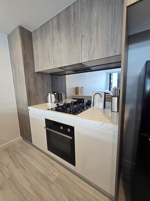 Fridge, microwave, oven, stovetop - Brand New 5 star Luxe Apartment Pool, Swim Up Bar, Rooftop Bar, near stadium (Gosford)