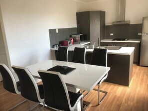 Fridge, microwave, oven, stovetop - Tasha's Apartments in Athol Park (Athol Park)