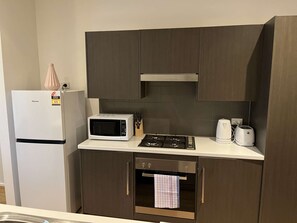 Fridge, microwave, oven, stovetop - Tasha's Apartments in Athol Park (Athol Park)