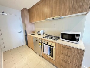 Fridge, microwave, oven, stovetop - Tasha's Apartments on Morphett (Adelaide)