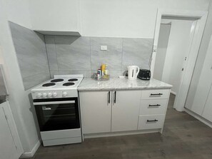 Fridge, microwave, oven, stovetop - Tasha's Duplex on Muller (Greenacres)