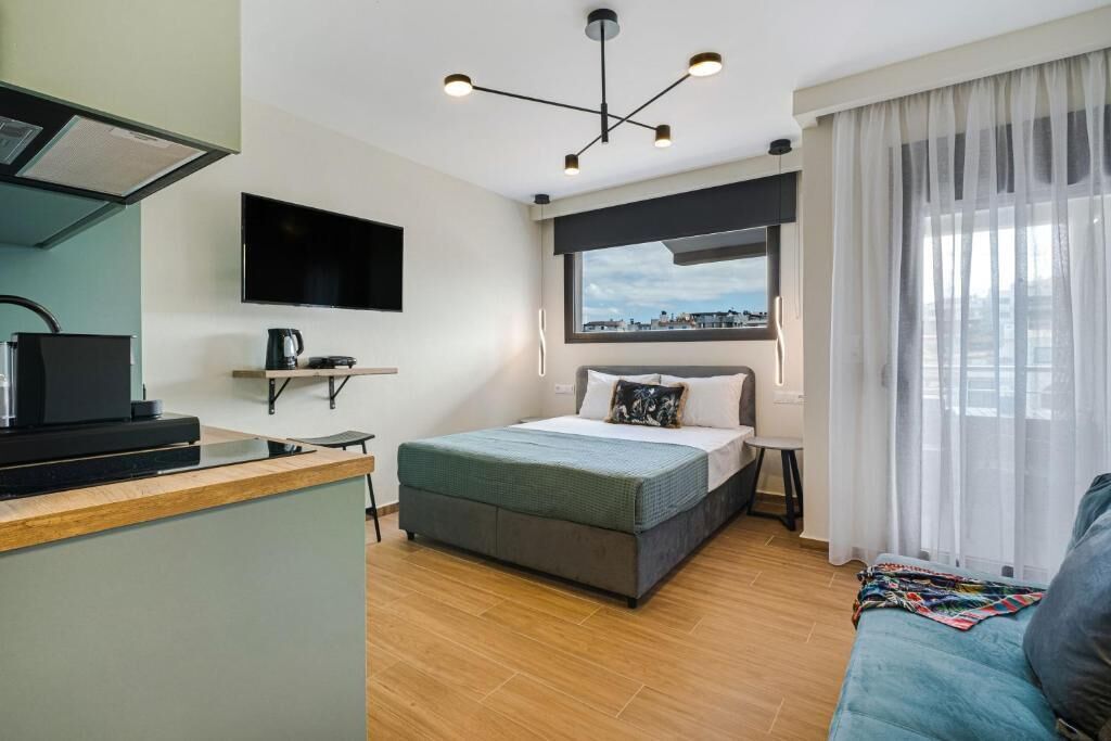 Classic Studio Suite, Balcony, City View | Iron/ironing board, free WiFi