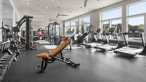 A gym with treadmills, weight machines, and benches. - Gateway Denton (Denton)