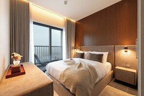 Appartement Deluxe | Coffres-forts dans les chambres, rideaux occultants